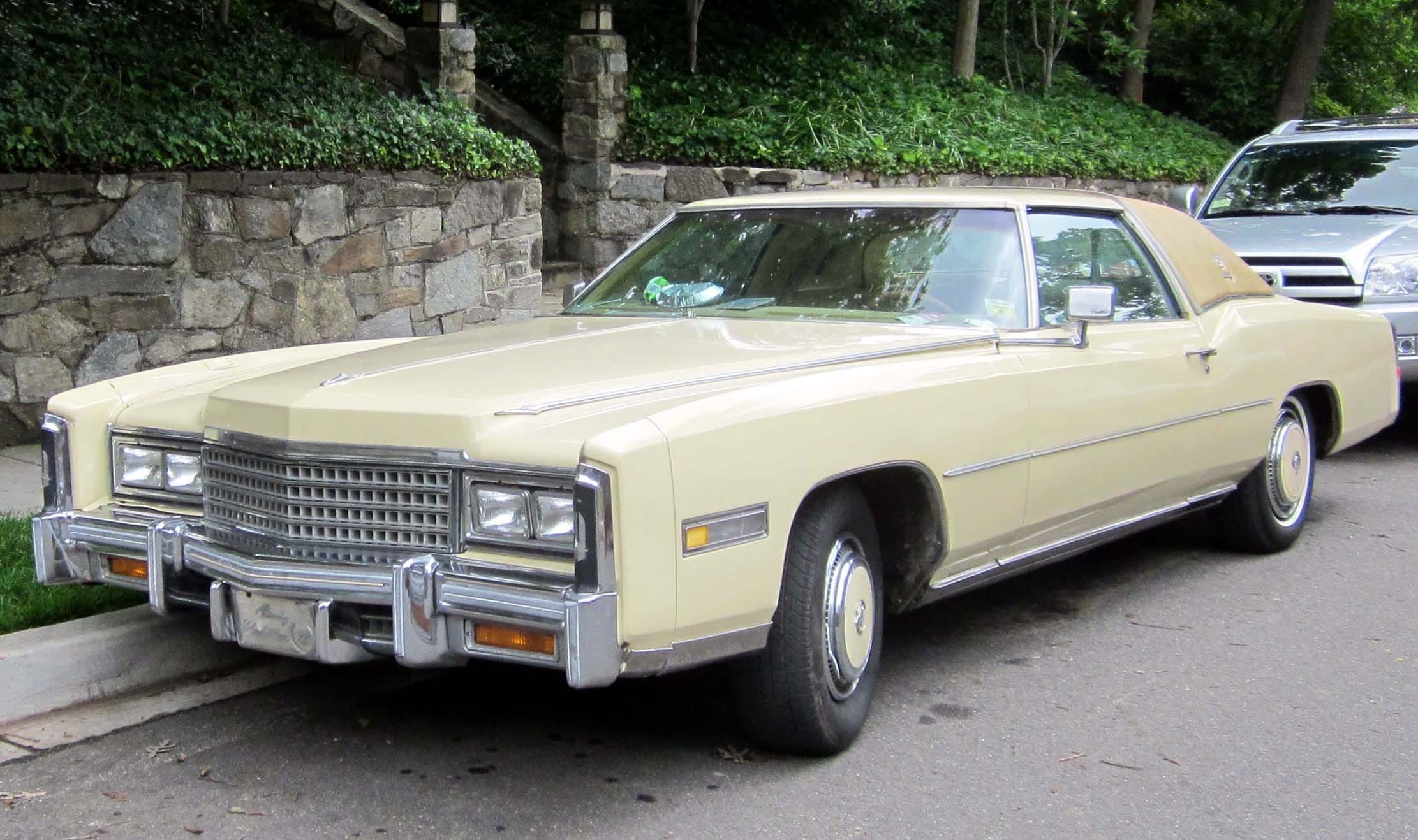 Classic 1970s Cadillac Eldorado coupe in pale yellow. We buy vintage luxury cars for cash in Southern California.