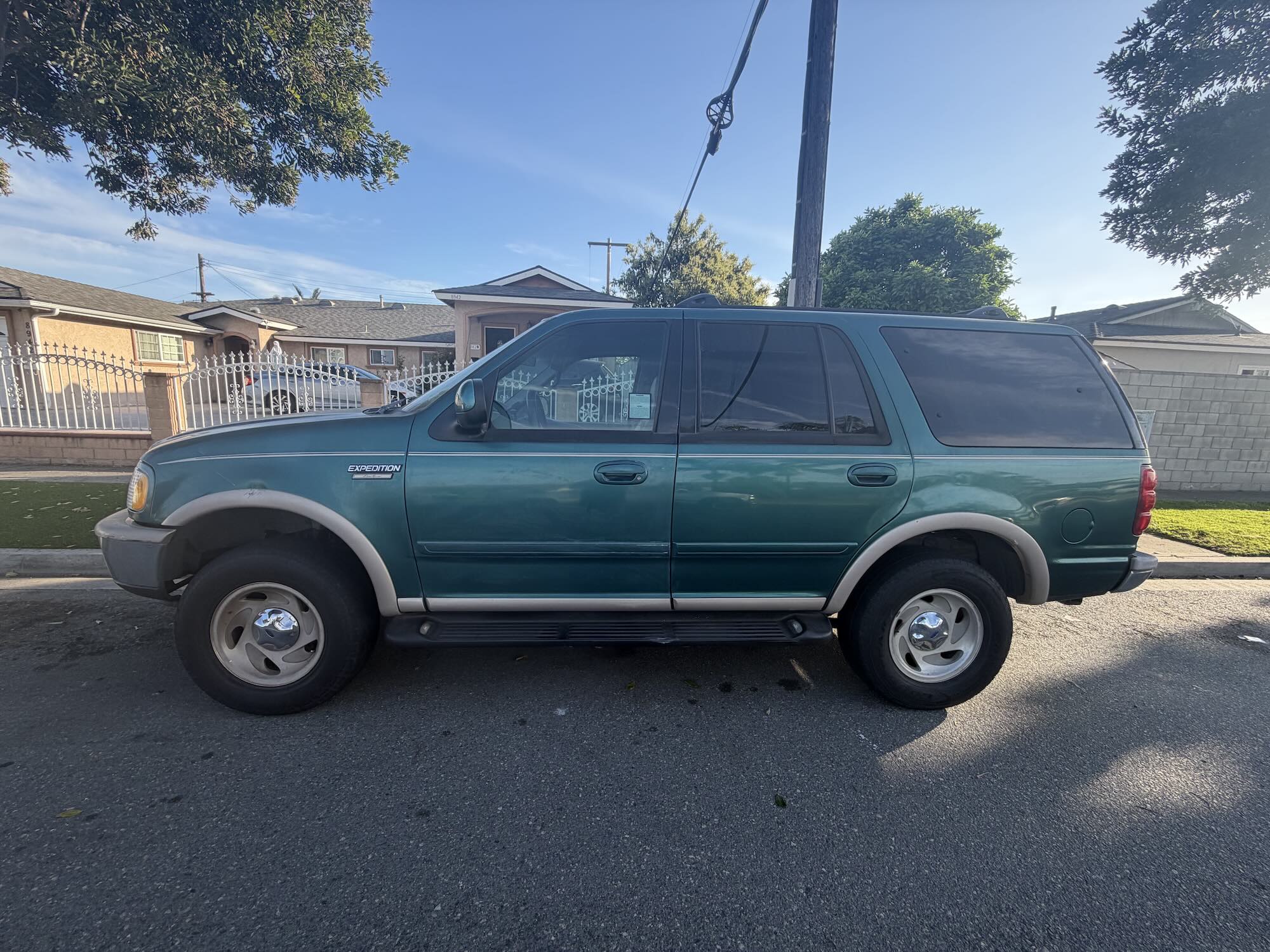 A used teal green Ford Expedition SUV purchased for cash by GoCarBuyer in San Bernardino, California