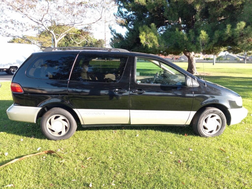 A used black Toyota Sienna minivan purchased for cash in Orange County, California we pay cash for older models, vehicles running or not.