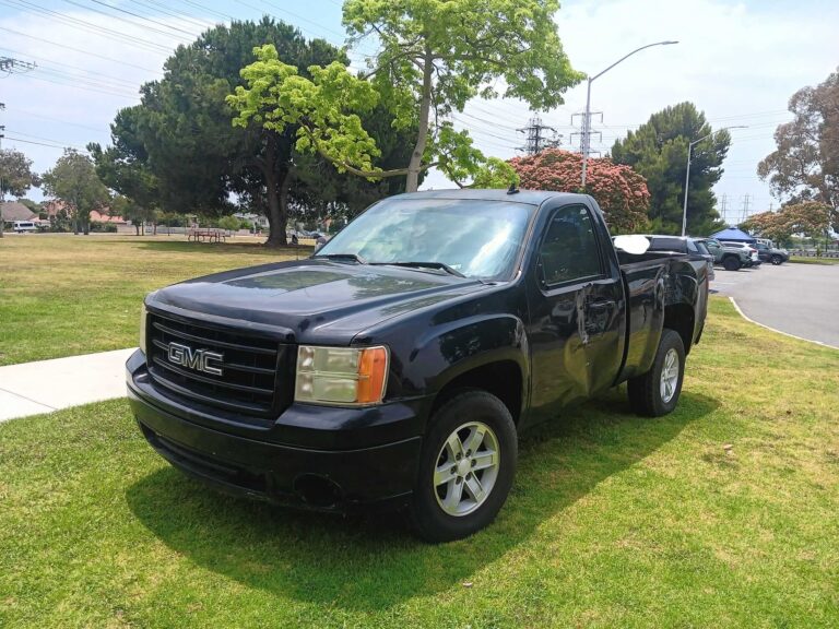 A used black GMC Sierra regular cab pickup truck purchased for cash by GoCarBuyer in San Diego, California