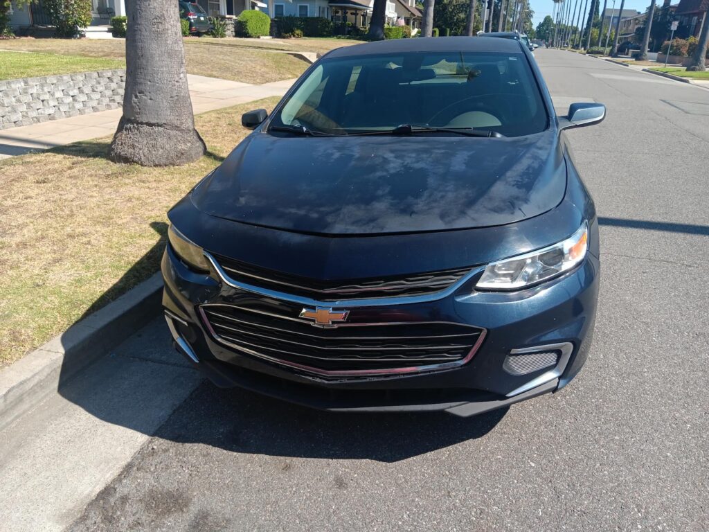 Dark blue Chevy Malibu sedan sold for cash in Huntington Beach Orange County