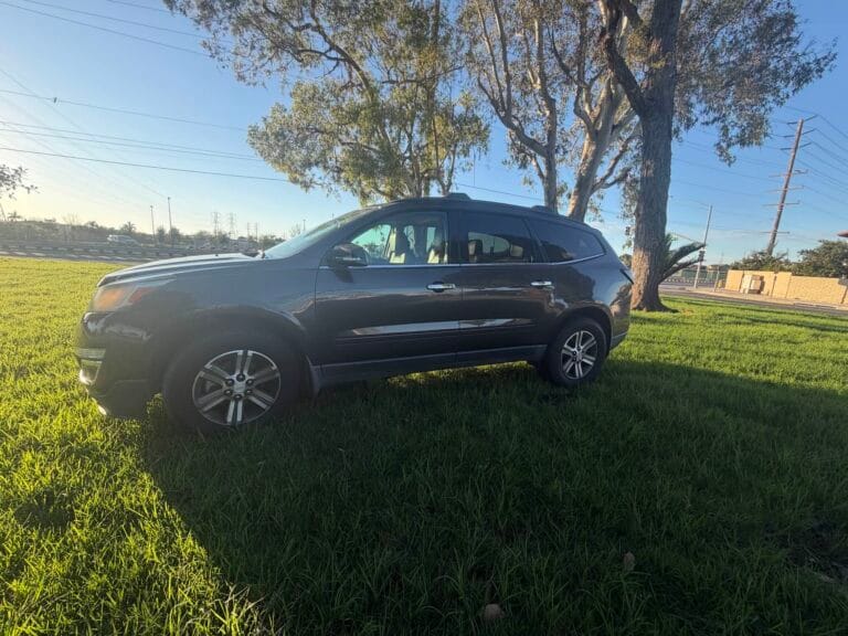 A used dark grey Chevrolet Traverse SUV purchased for cash by GoCarBuyer in Riverside, California