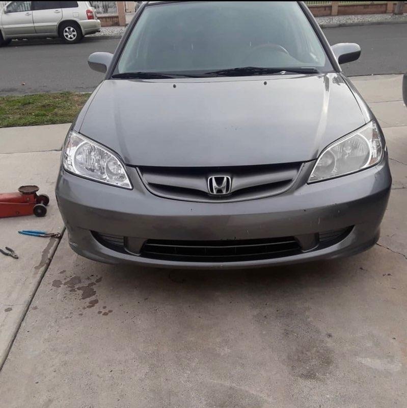 A used grey Honda Civic sedan purchased for cash by GoCarBuyer in Los Angeles, California