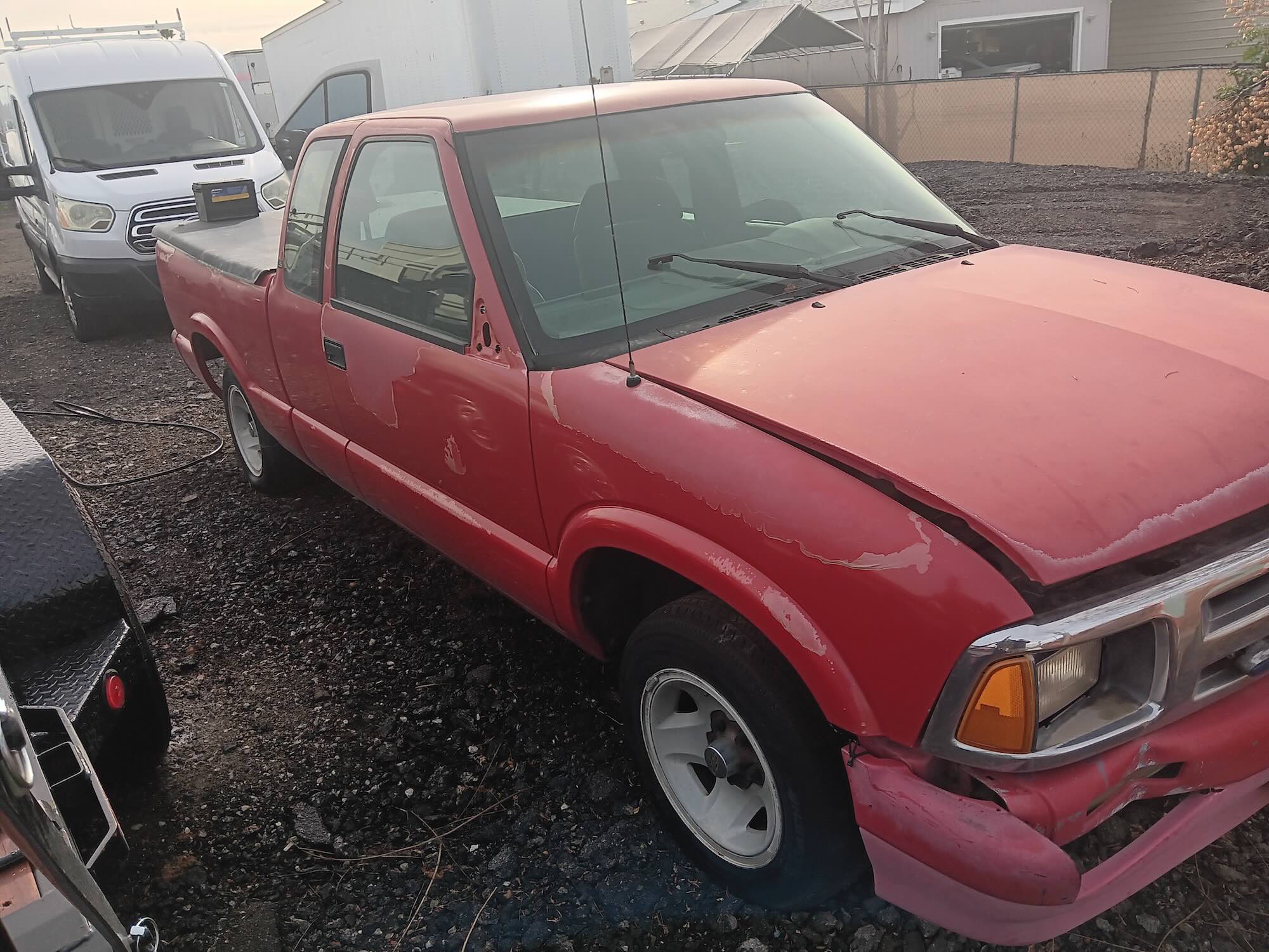 A used red Chevrolet S-10 extended cab pickup truck purchased for cash by GoCarBuyer in Riverside, California