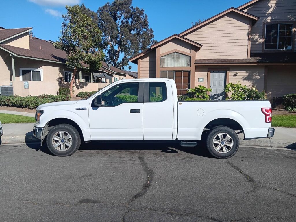 White Ford F-150 SuperCab truck sold for cash in Anaheim Orange County