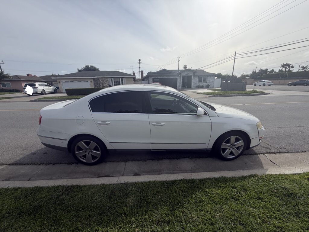 White Volkswagen Passat sedan sold for cash in Costa Mesa Orange County