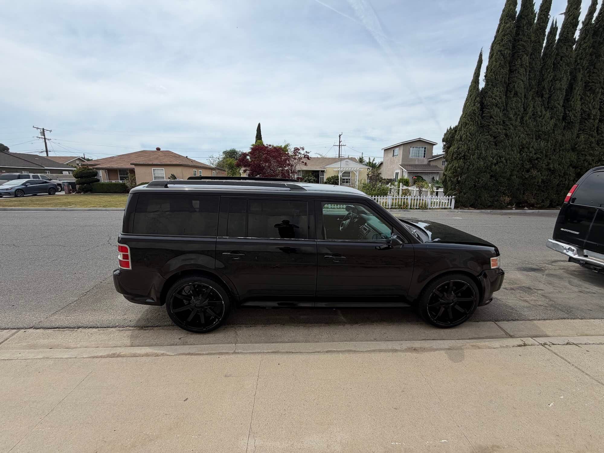 Black 2012 Ford Flex purchased for cash by Go Car Buyer in Southern California