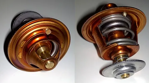 Close-up of a new copper and brass automotive replacement thermostat for fixing an overheating car