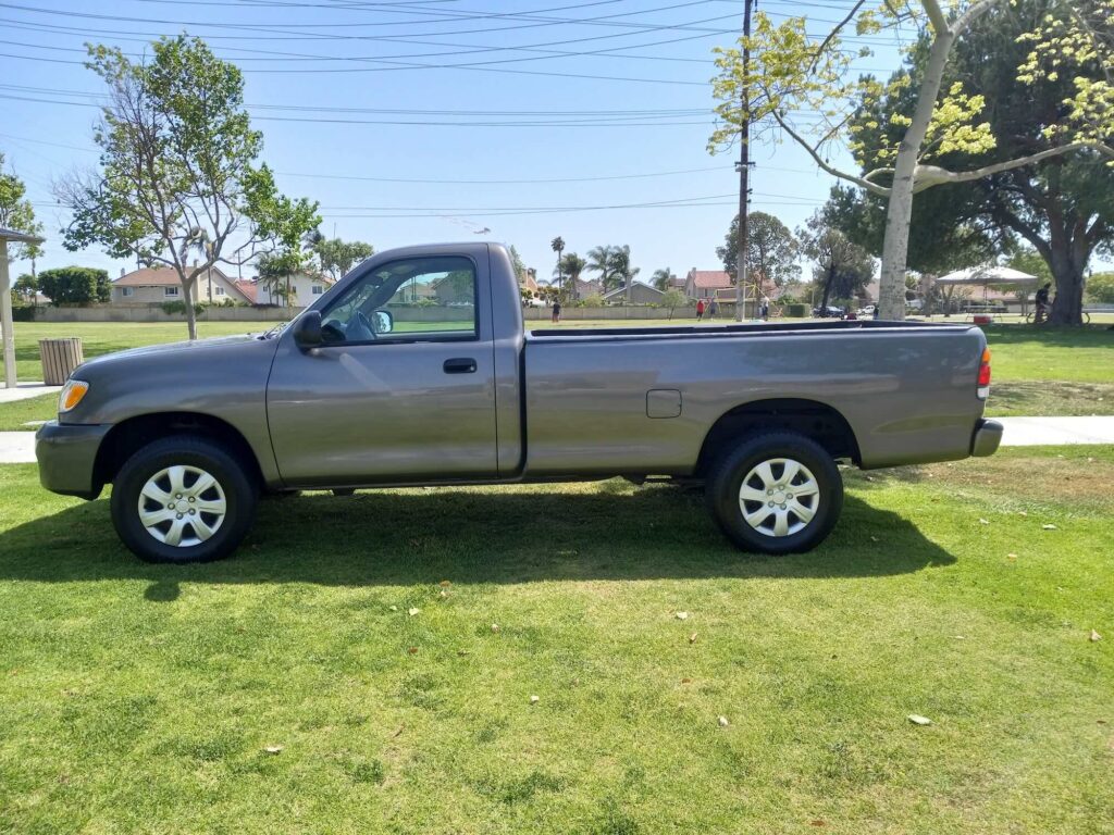 Gray, single-cab Toyota Tacoma. We buy used and damaged Tacomas for cash across Orange County and SoCal.