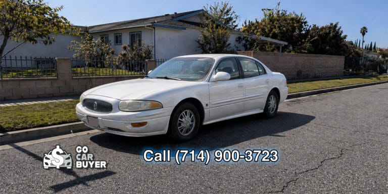A well-kept white Buick LeSabre parked in a Southern California neighborhood. Local car buyer purchasing elderly-owned vehicles for top dollar cash, check, or Zelle.